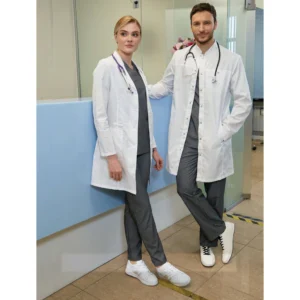 Two healthcare professionals wearing white medical coats and grey trousers at a clinic reception