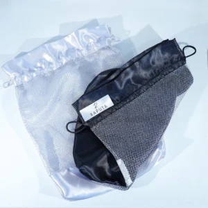 Black and white satin drawstring pouches with transparent mesh panels and a Raputa label